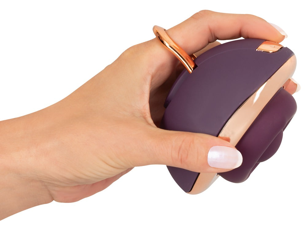Belou Rotating Vulva Massager in hand