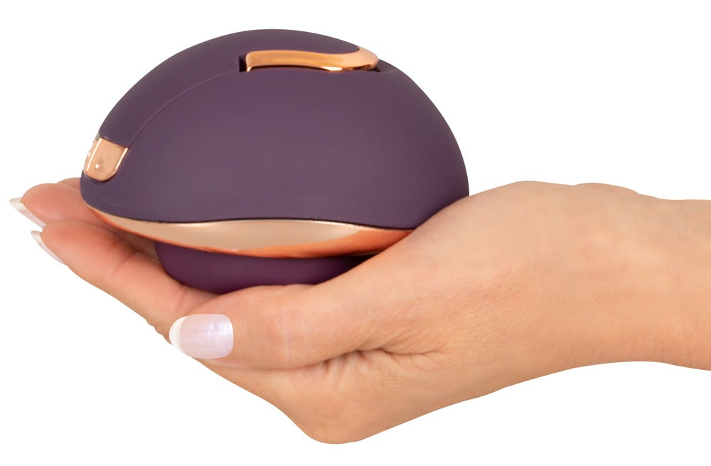 Belou Rotating Vulva Massager in hand