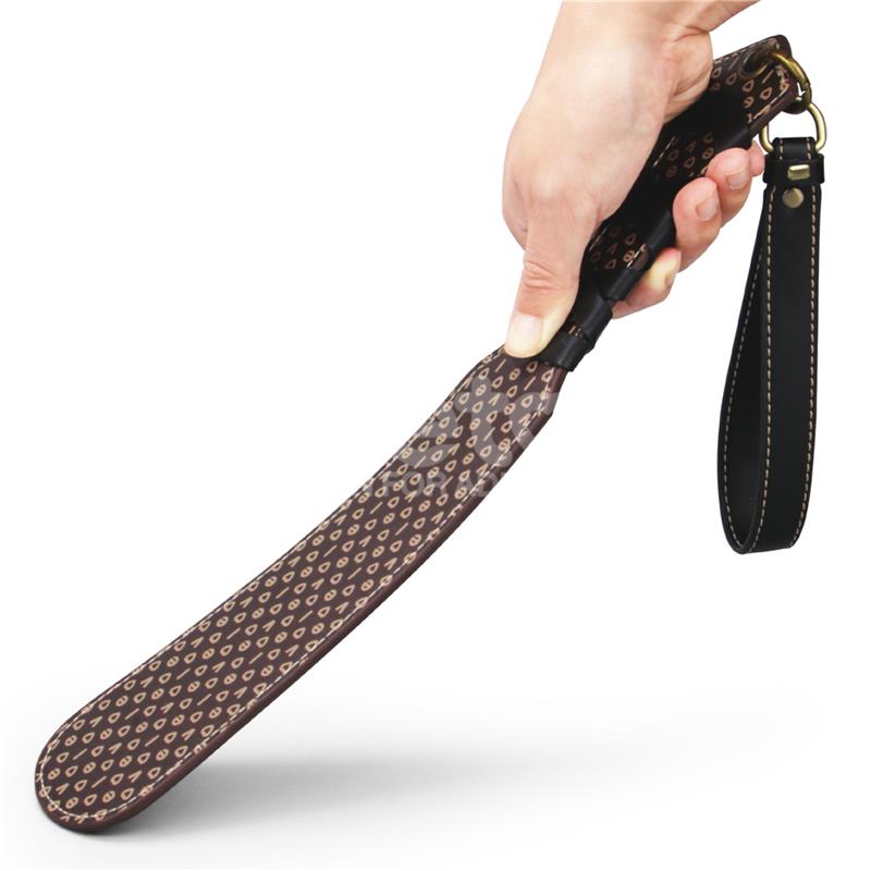 Lovetoy Rebellion Reign Love Paddle in hand