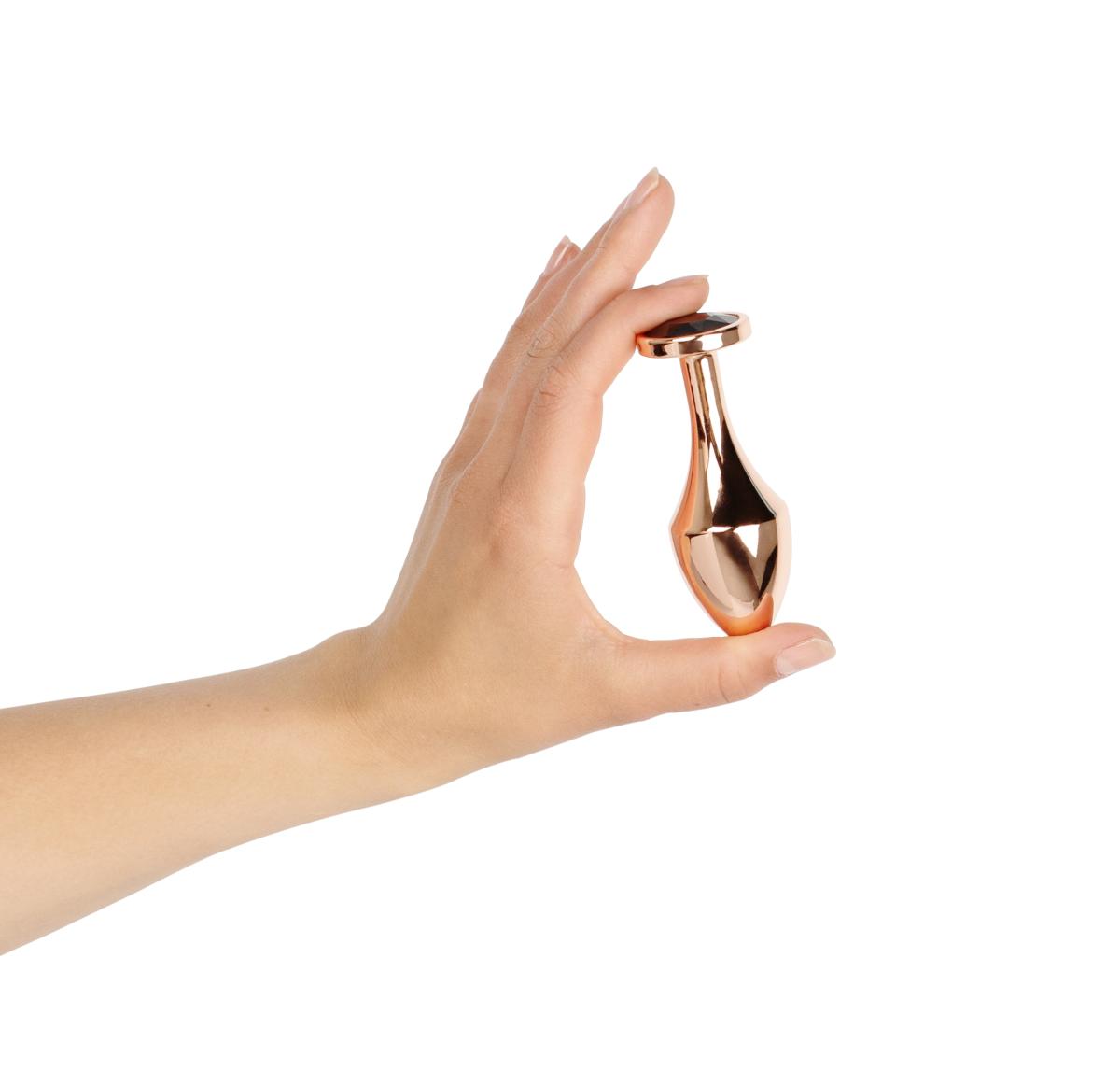 Rosy Gold - Nouveau Butt Plug in hand
