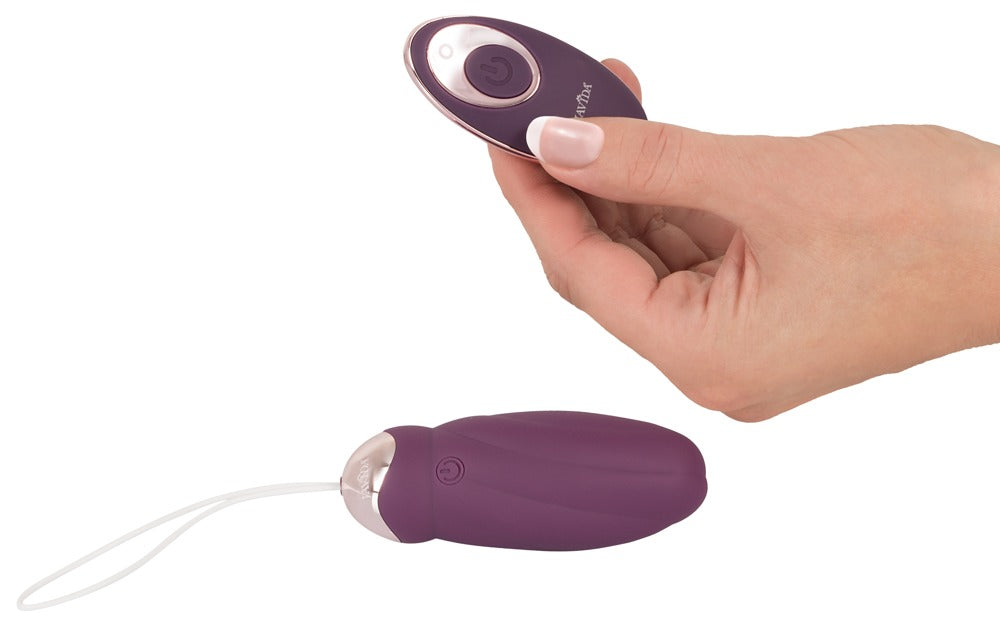 Javida Remote Control Rotating Pearl Love Ball remote in hand