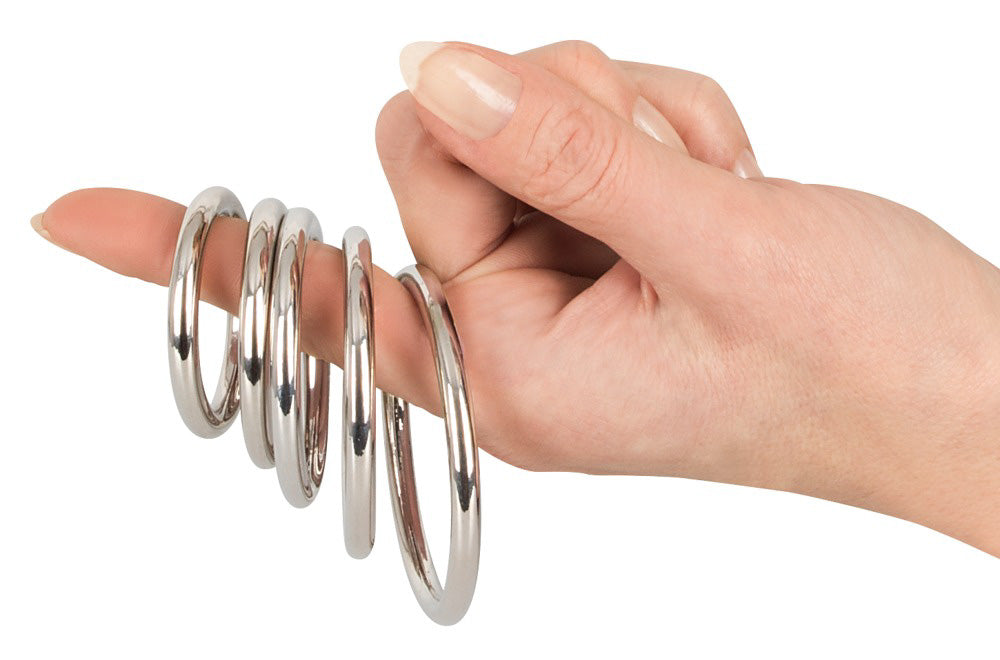 Bad Kitty Professional 5pk Steel Cock Rings on finger